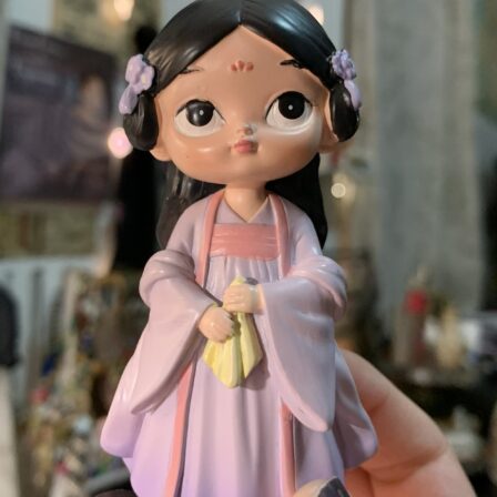 Purple Doll figurine