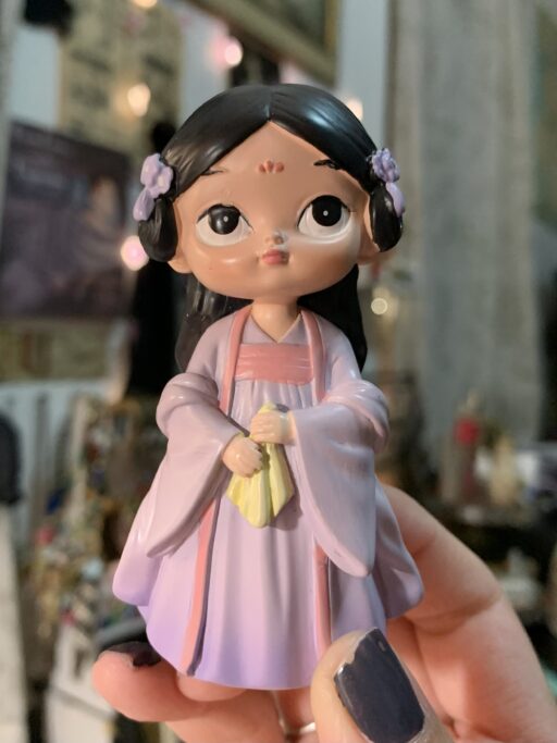 Purple Doll figurine