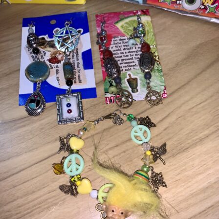 Witch two pairs earrings trolls bracelet